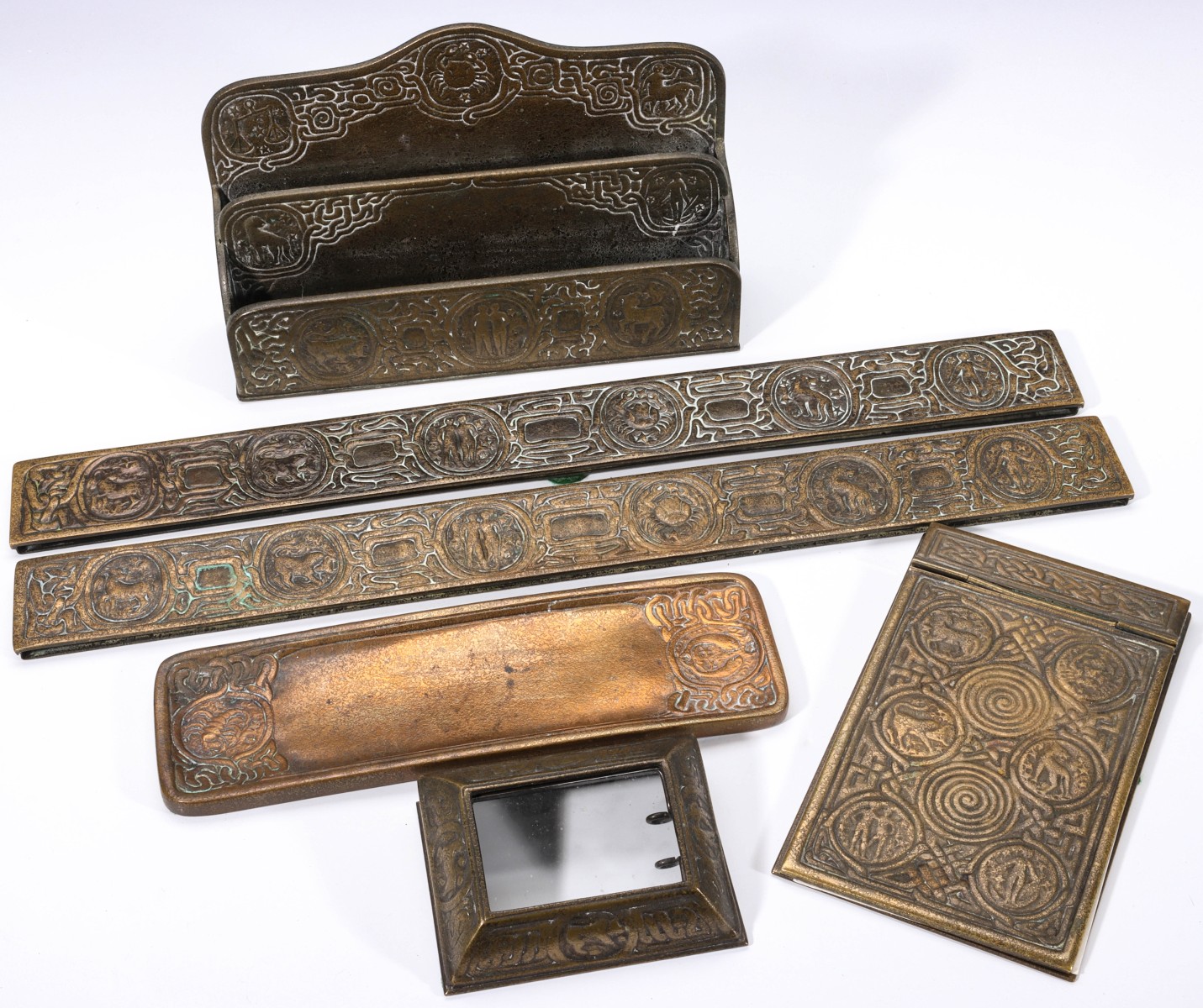 A SIX-PIECE TIFFANY STUDIOS ZODIAC PATTERN DESK SET
