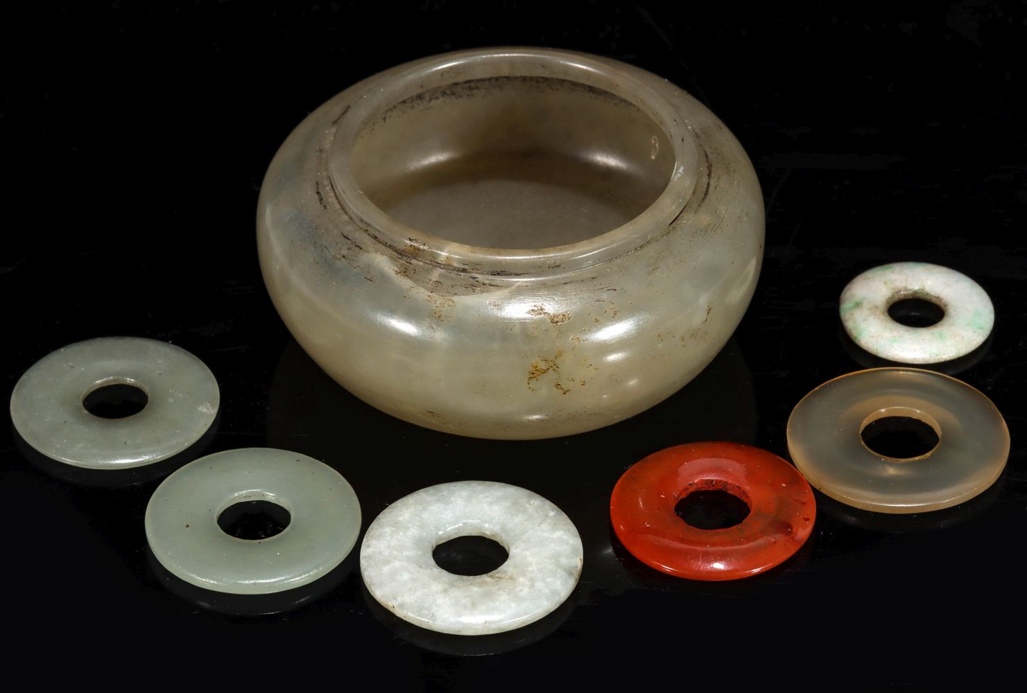 A 19TH CENTURY CHINESE JADE BRUSH WASHER AND PENDANTS