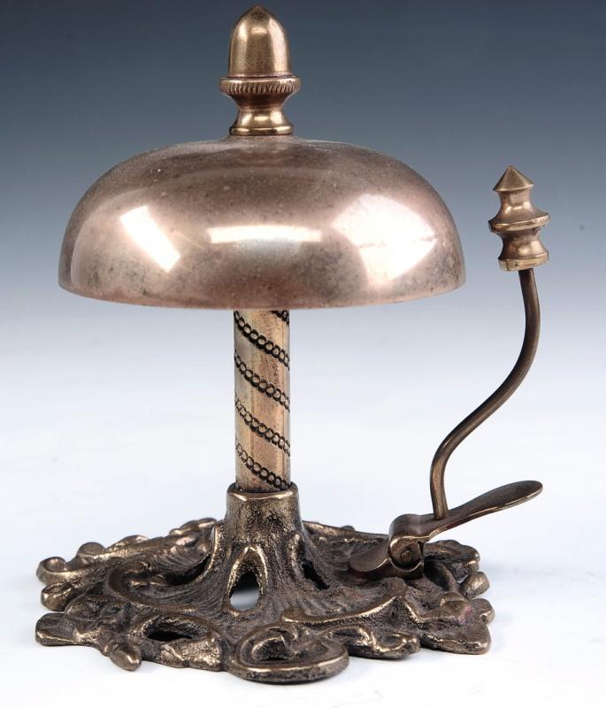 A GOOD ANTIQUE BRASS DESK BELL ON ORNATE PEDESTAL