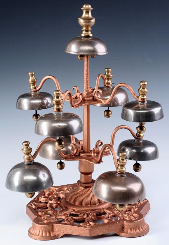 A THREE TIER, NINE BELL ARRANGEMENT OF HARNESS BELLS