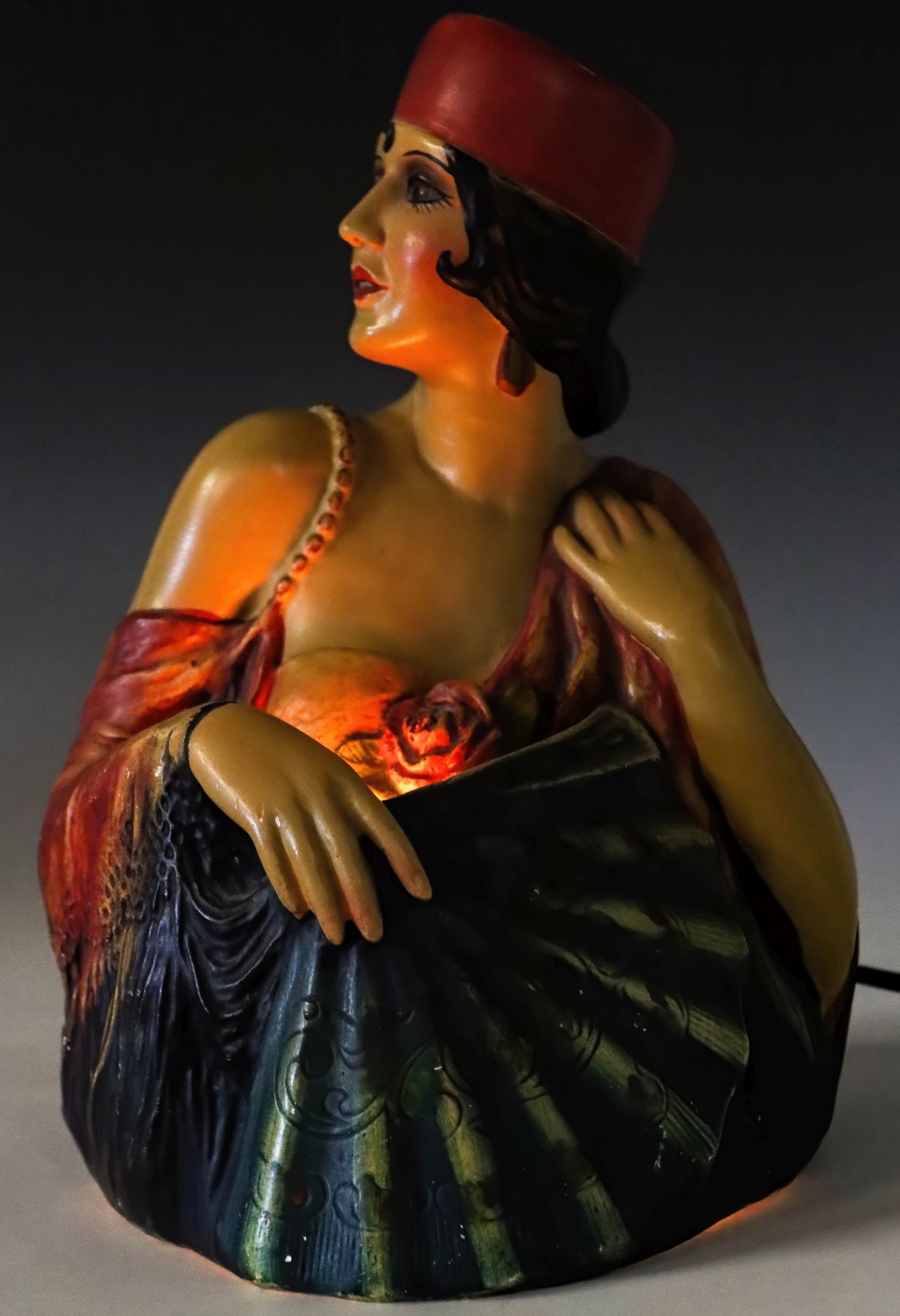 A POLYCHROME ENAMEL PLASTER FAN DANCER LAMP