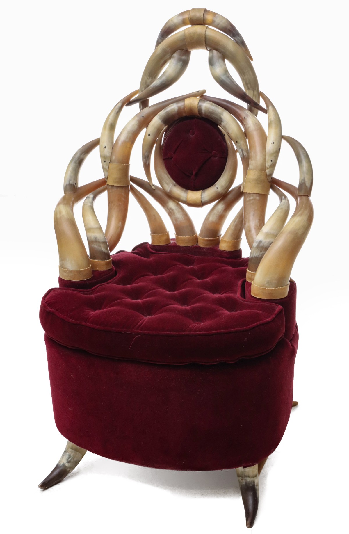 AN ELABORATE 20TH C. HORN CHAIR WITH BURGUNDY VELVET