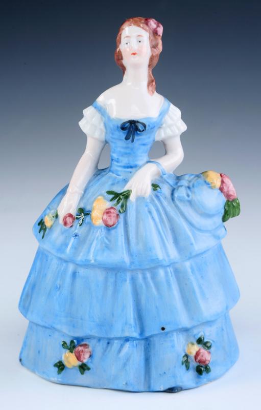 A GERMAN PORCELAIN FIGURAL LADY BELL 