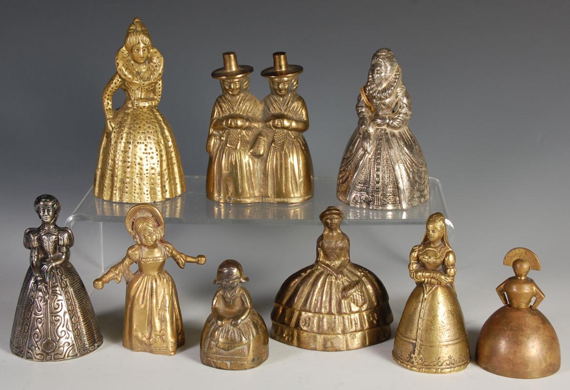 NINE BRASS FIGURAL LADY BELLS