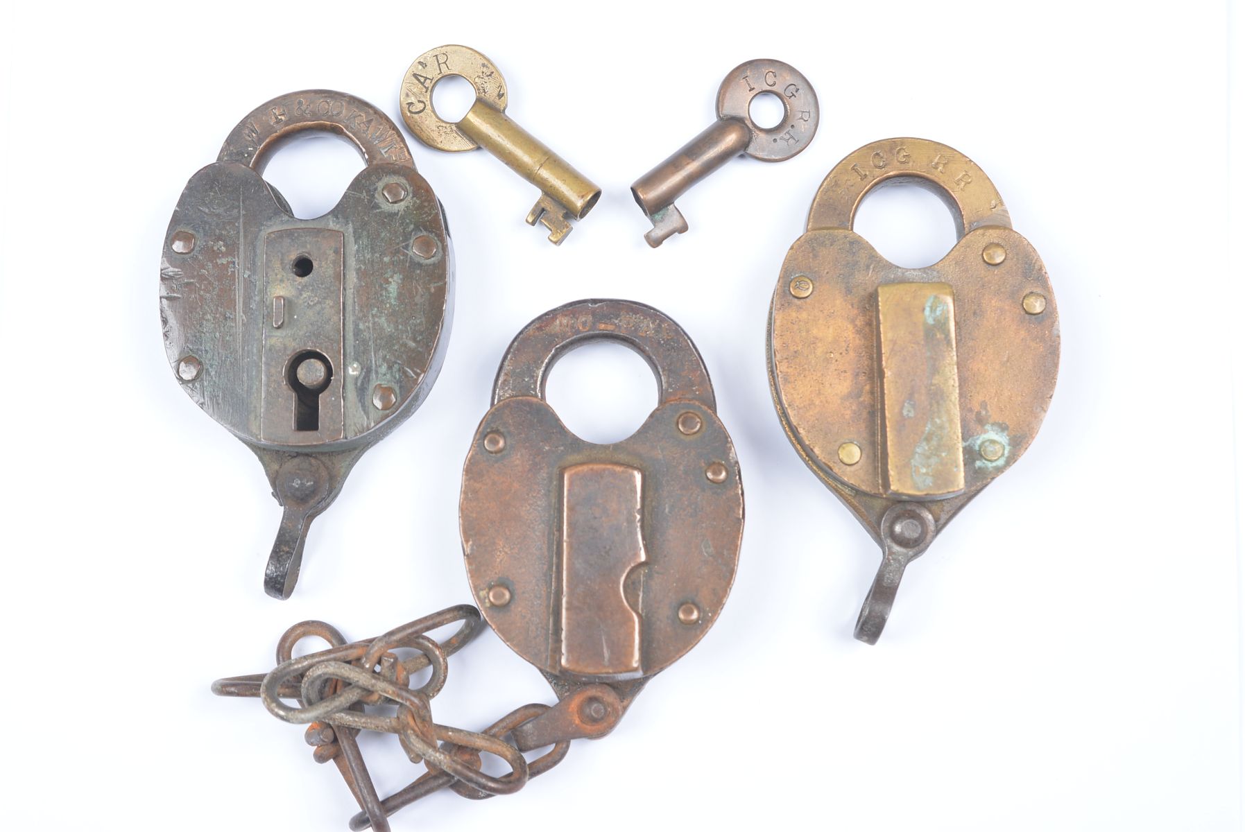 THREE BRASS PADLOCKS WITH RAILROAD MARKINGS