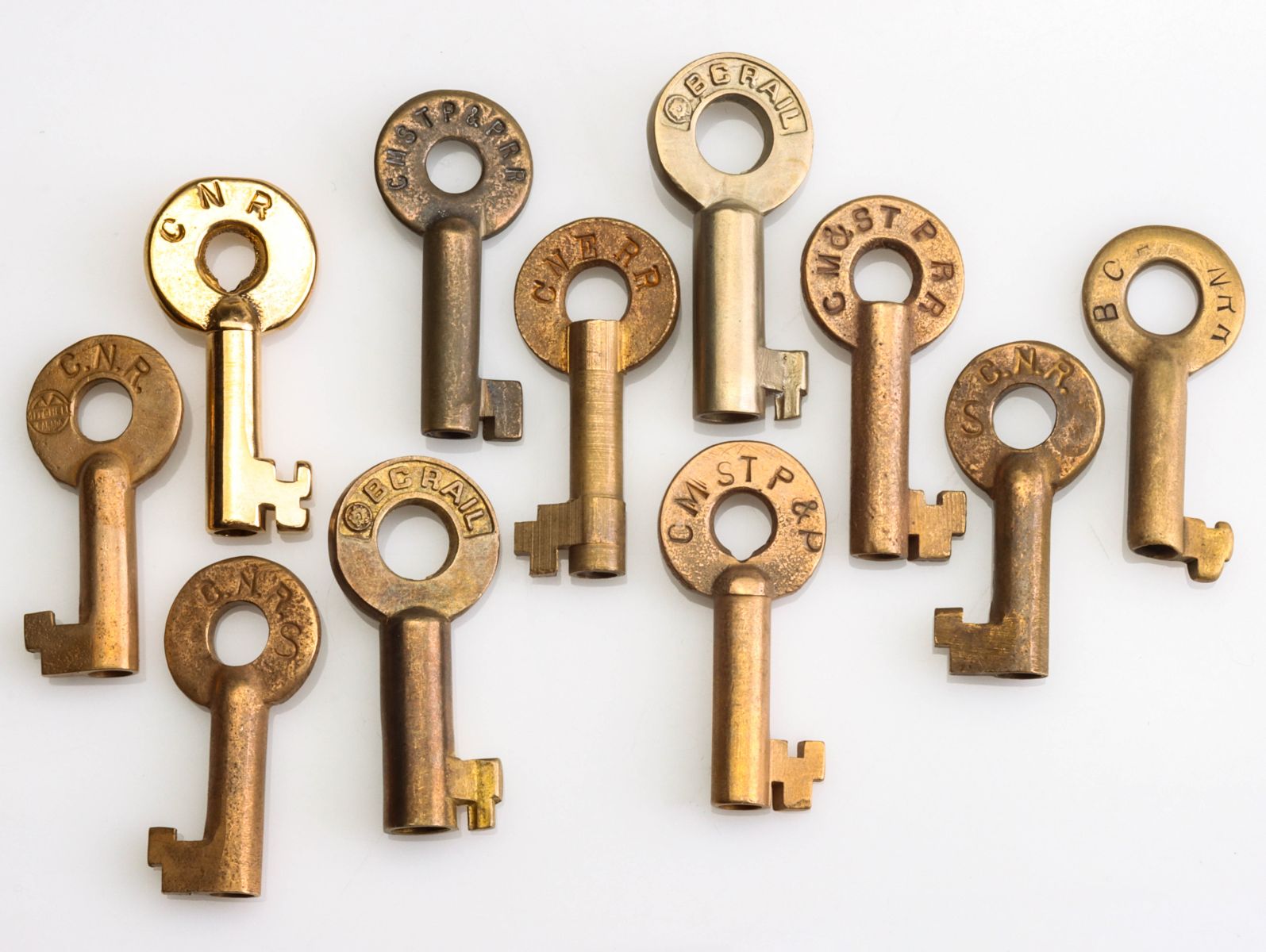 A COLLECTION OF SWITCH KEYS WITH RAILROAD MARKINGS