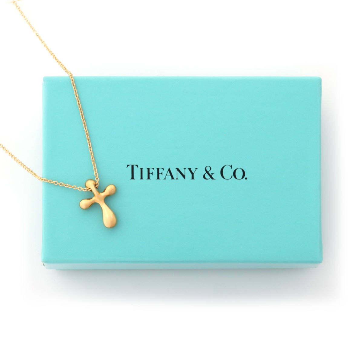 AN ELSA PERETTI 18K GOLD CROSS FOR TIFFANY & CO