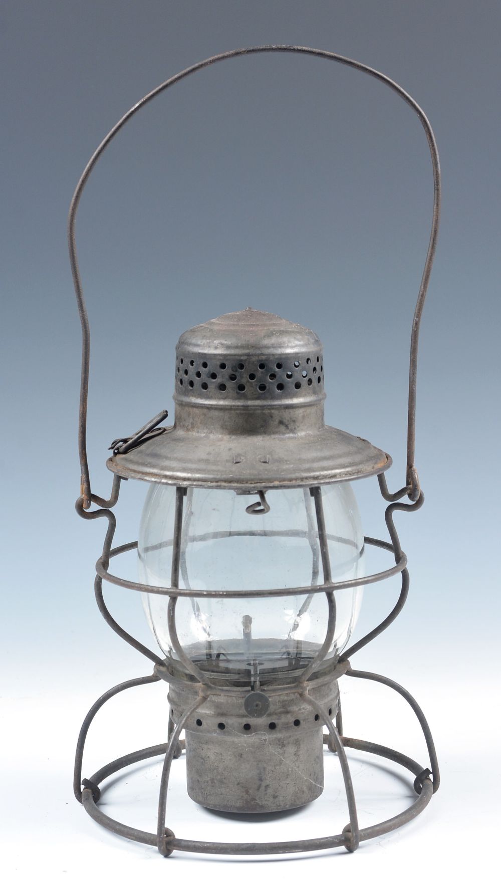 A TALL GLOBE RAILROAD LANTERN MARKED C.M.&ST.P.