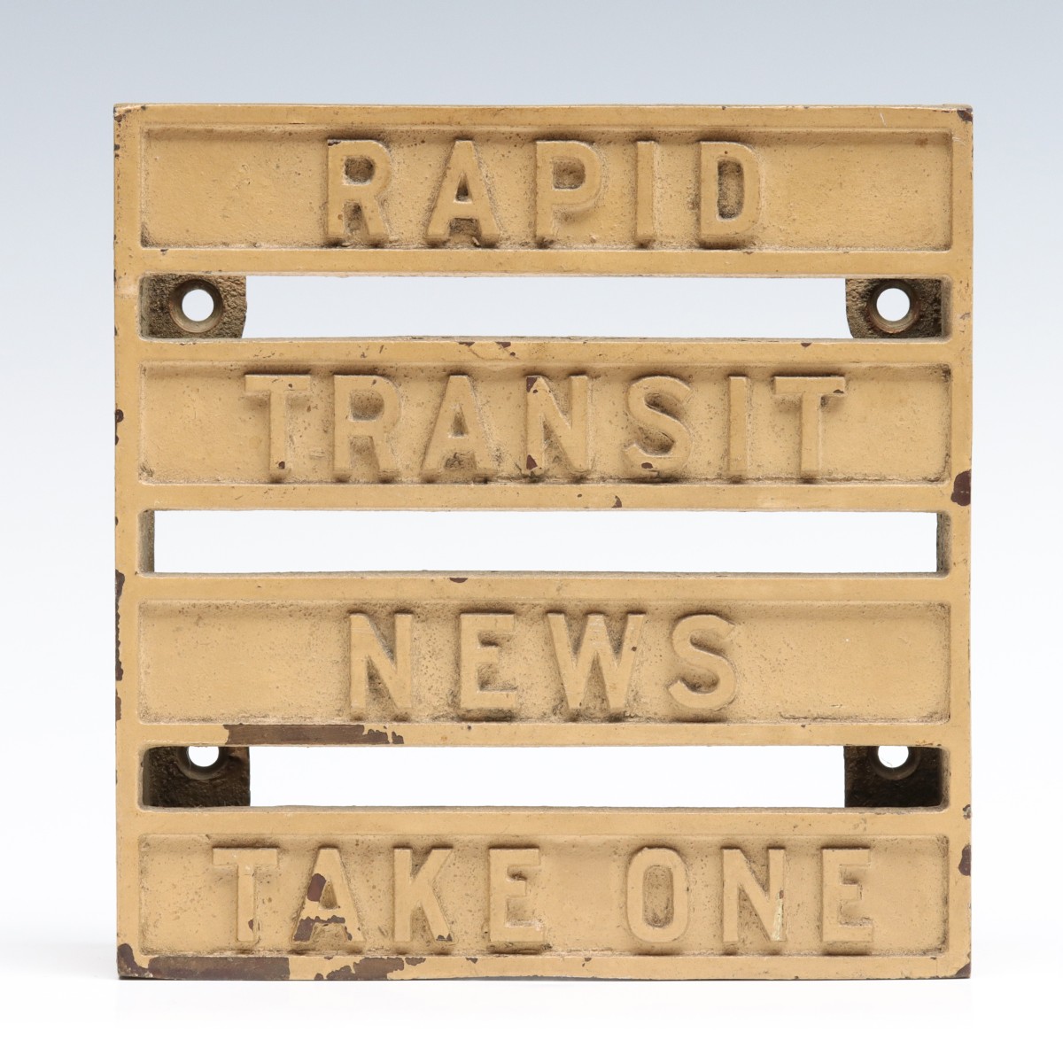 A CAST BRASS BROCHURE HOLDER FOR RAPID TRANSIT NEWS