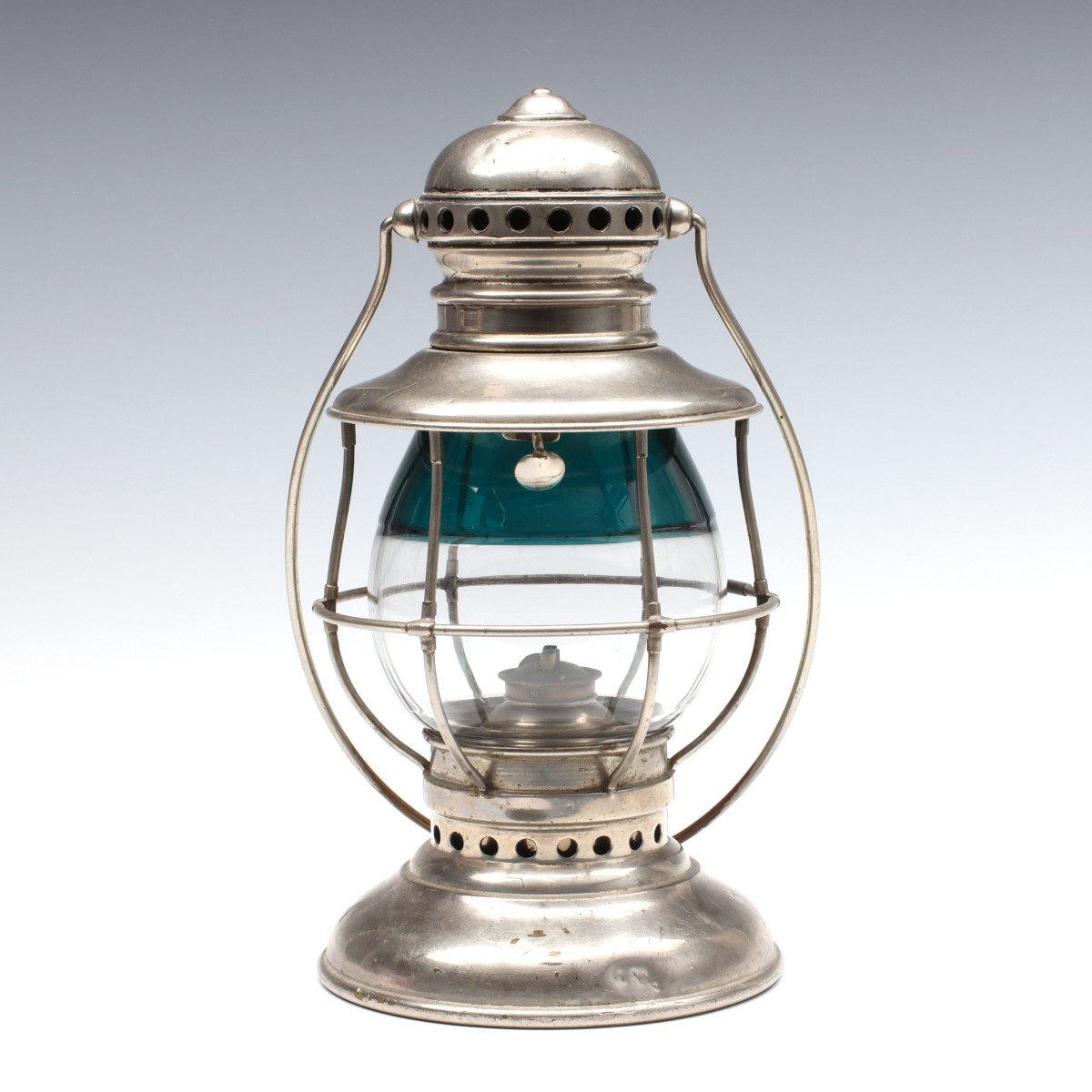 AN ADAMS & WESTLAKE CONDUCTORS LANTERN WITH GREEN GLOBE