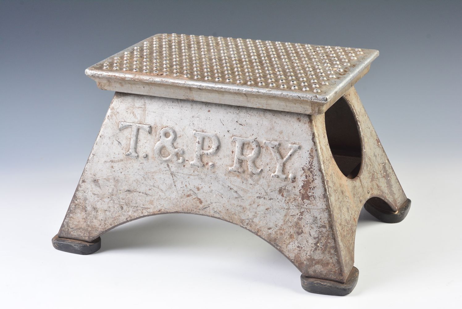 A PRESSED STEEL STEP BOX EMBOSSED T. & P. RY.