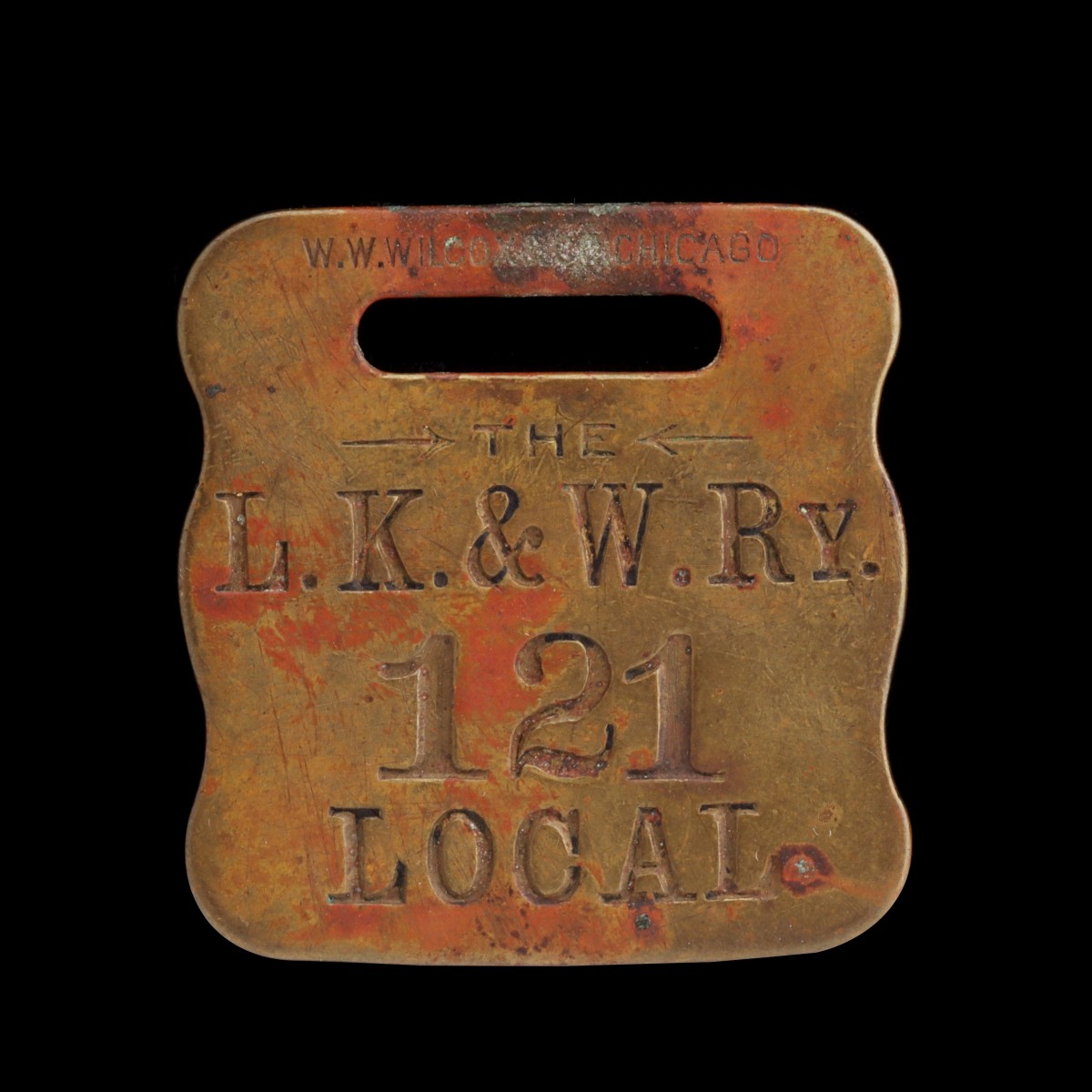 A RARE LEAVENWORTH, KANSAS AND WESTERN BAGGAGE TAG