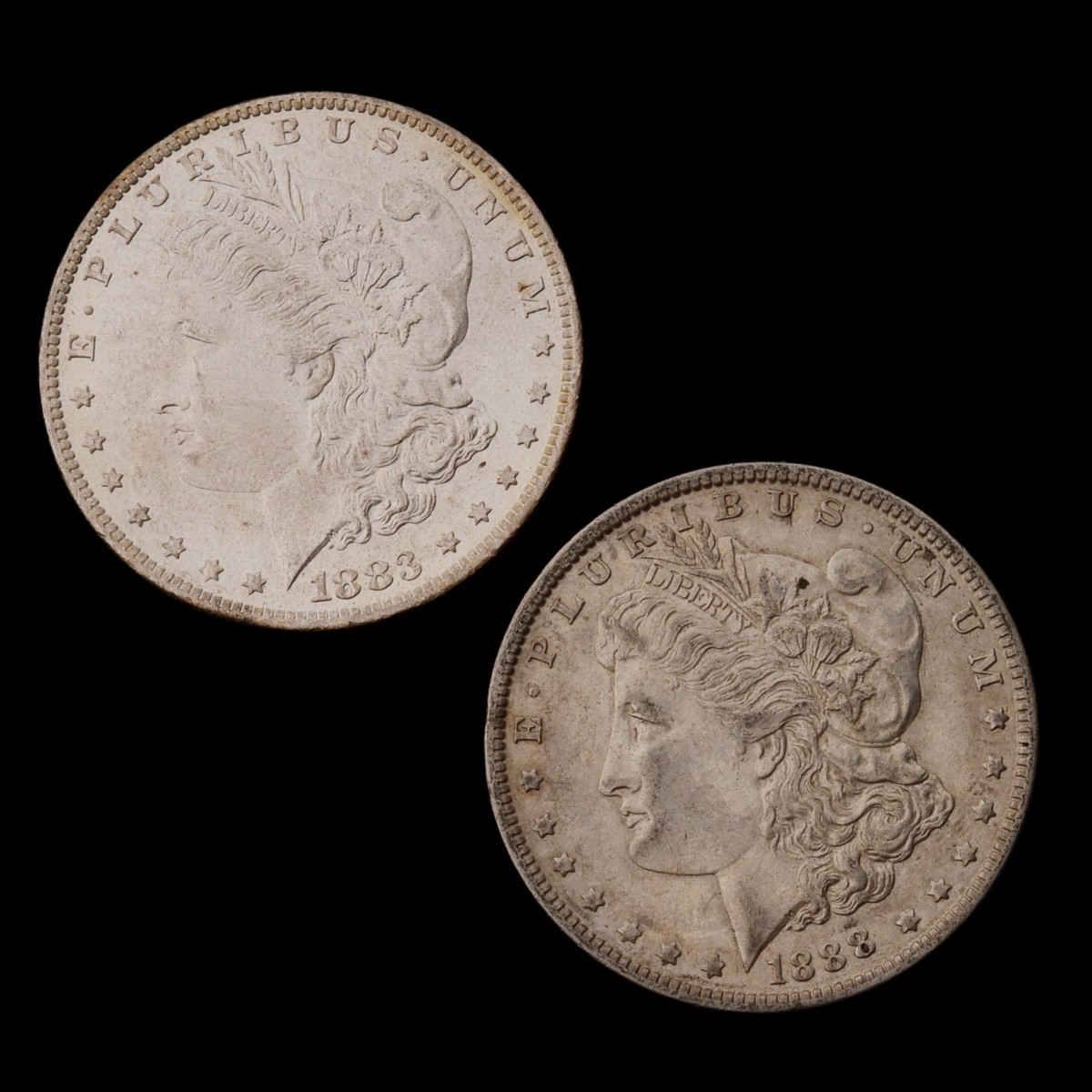 TWO HIGHER GRADE MORGAN SILVER DOLLARS, 1883-O & 1888-O
