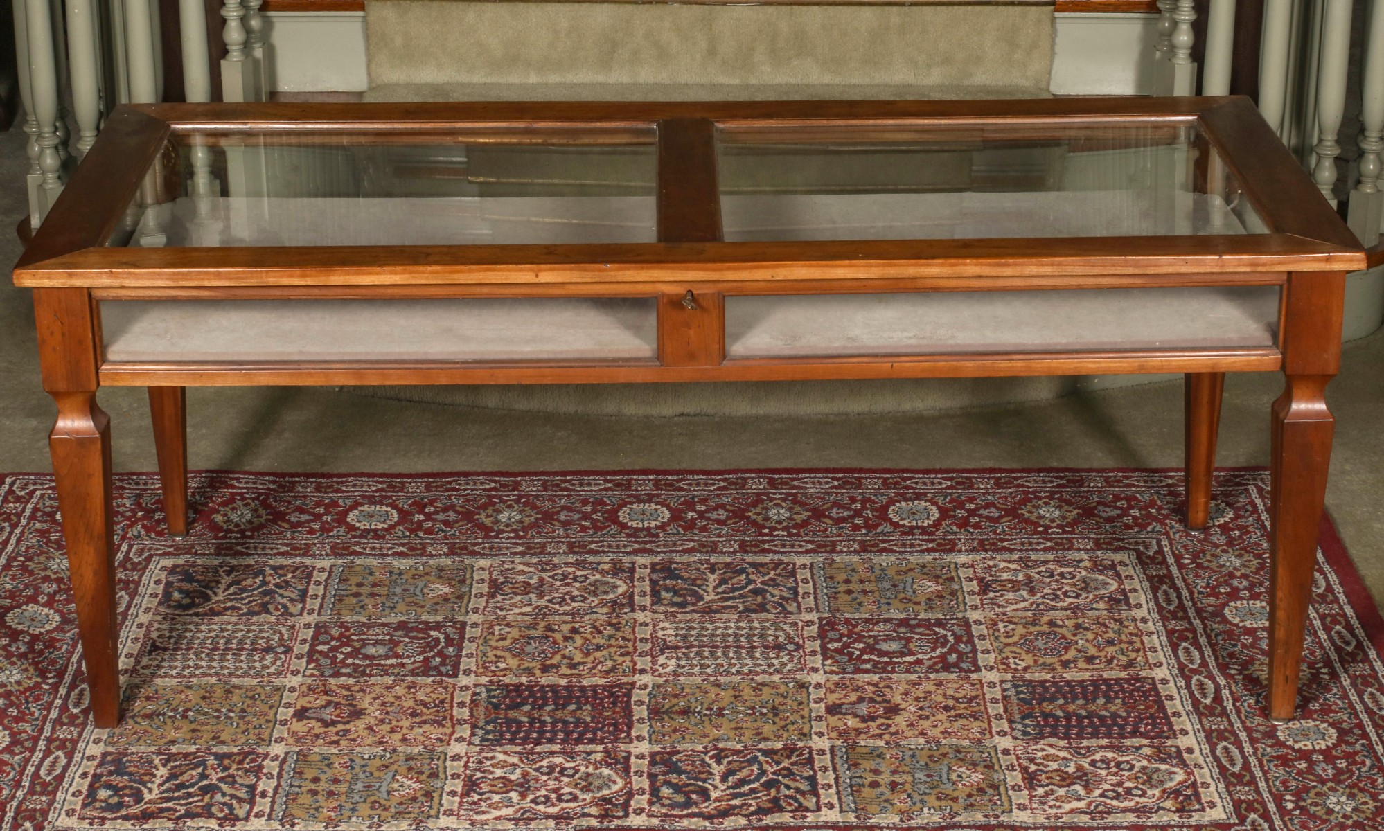 AN EARLY 20TH CENTURY FRUITWOOD VITRINE