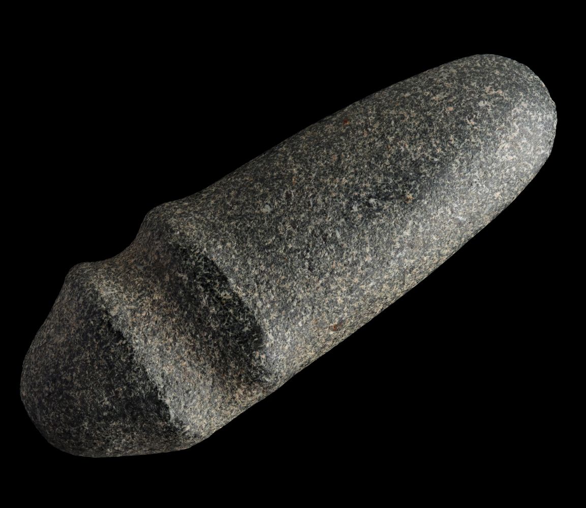 A 9-INCH STONE AXE HEAD OF UNKNOWN ORIGIN