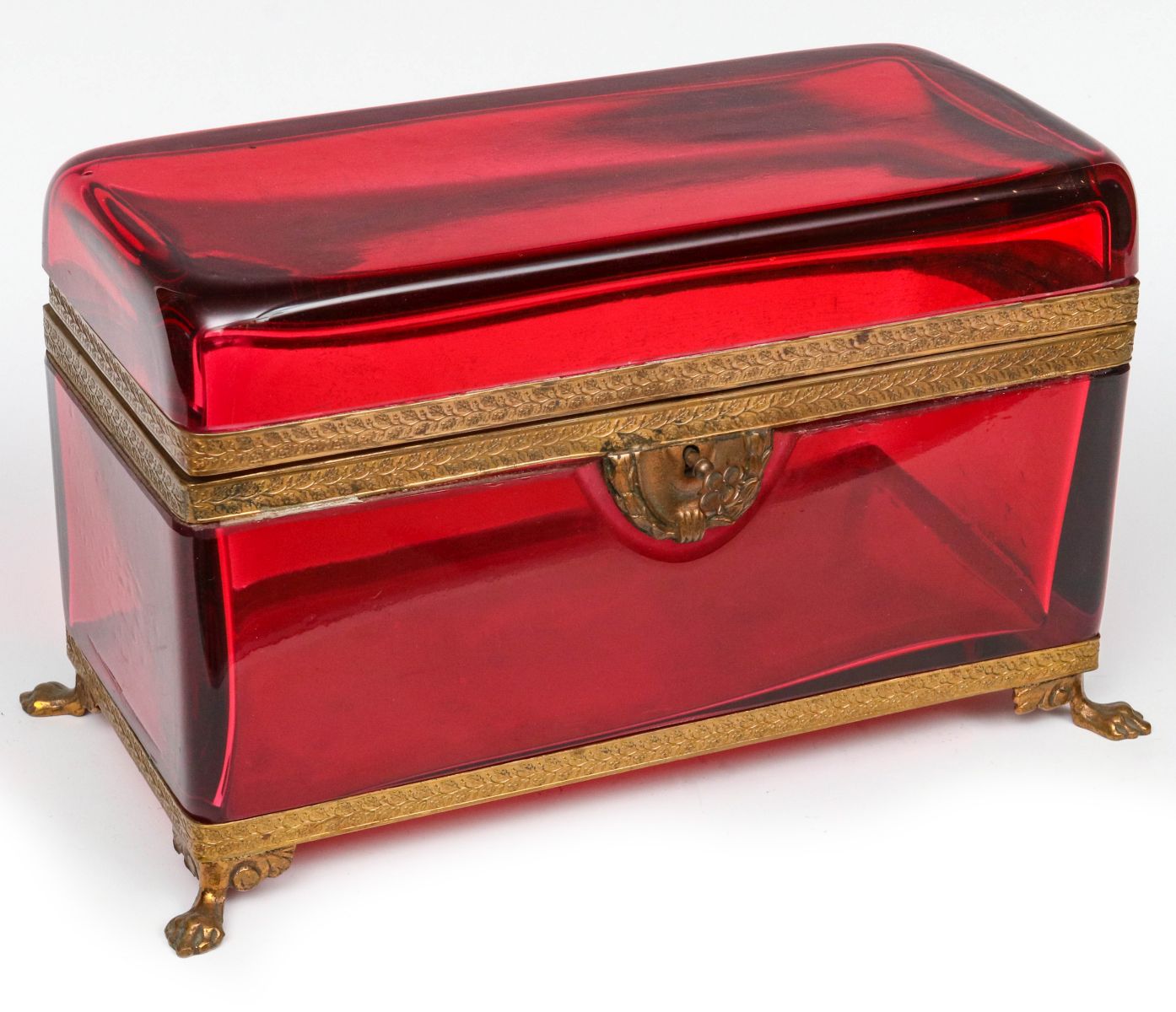 A FRENCH POLISHED RUBY GLASS AND ORMOLU CASKET