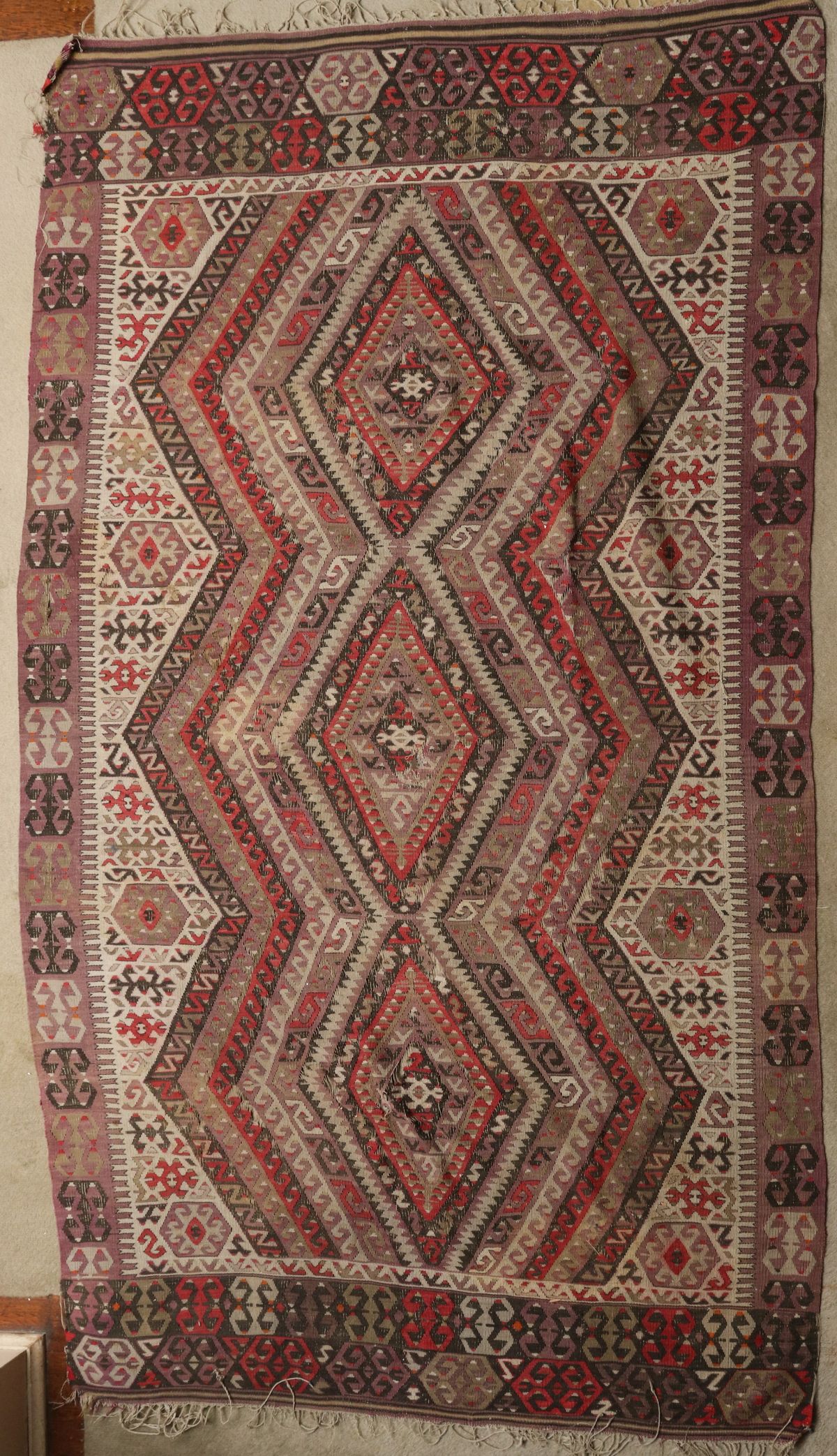 AN EARLY 20TH CENTURY CAUCASIAN KILIM