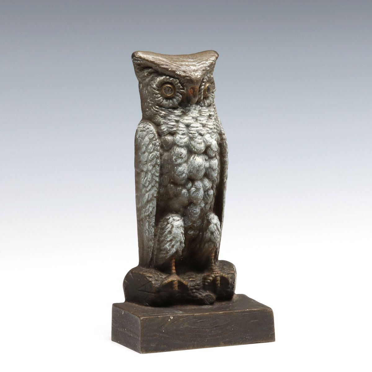 A CAST IRON OWL ON LOG DOORSTOP SIGNED BRADLEY HUBBARD