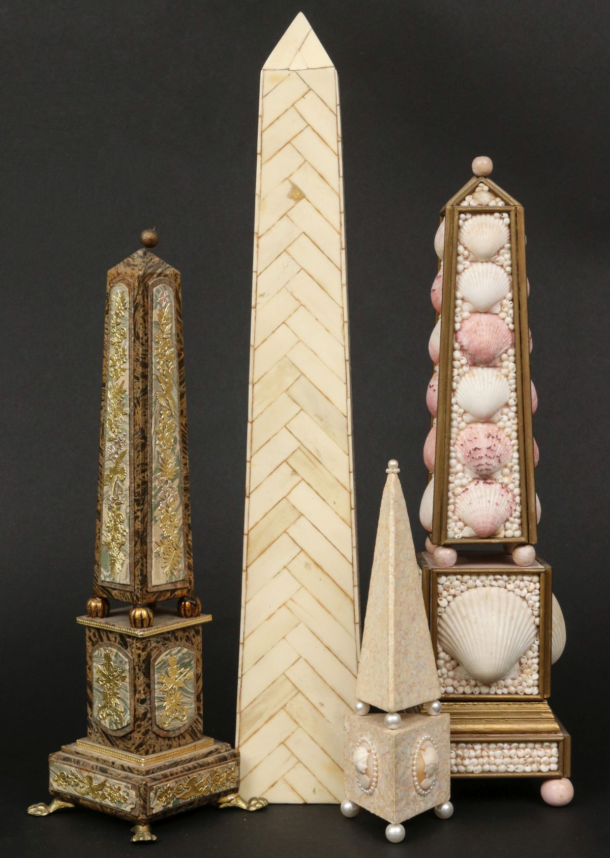 A COLLECTION OF FOUR DECORATIVE OBELISKS