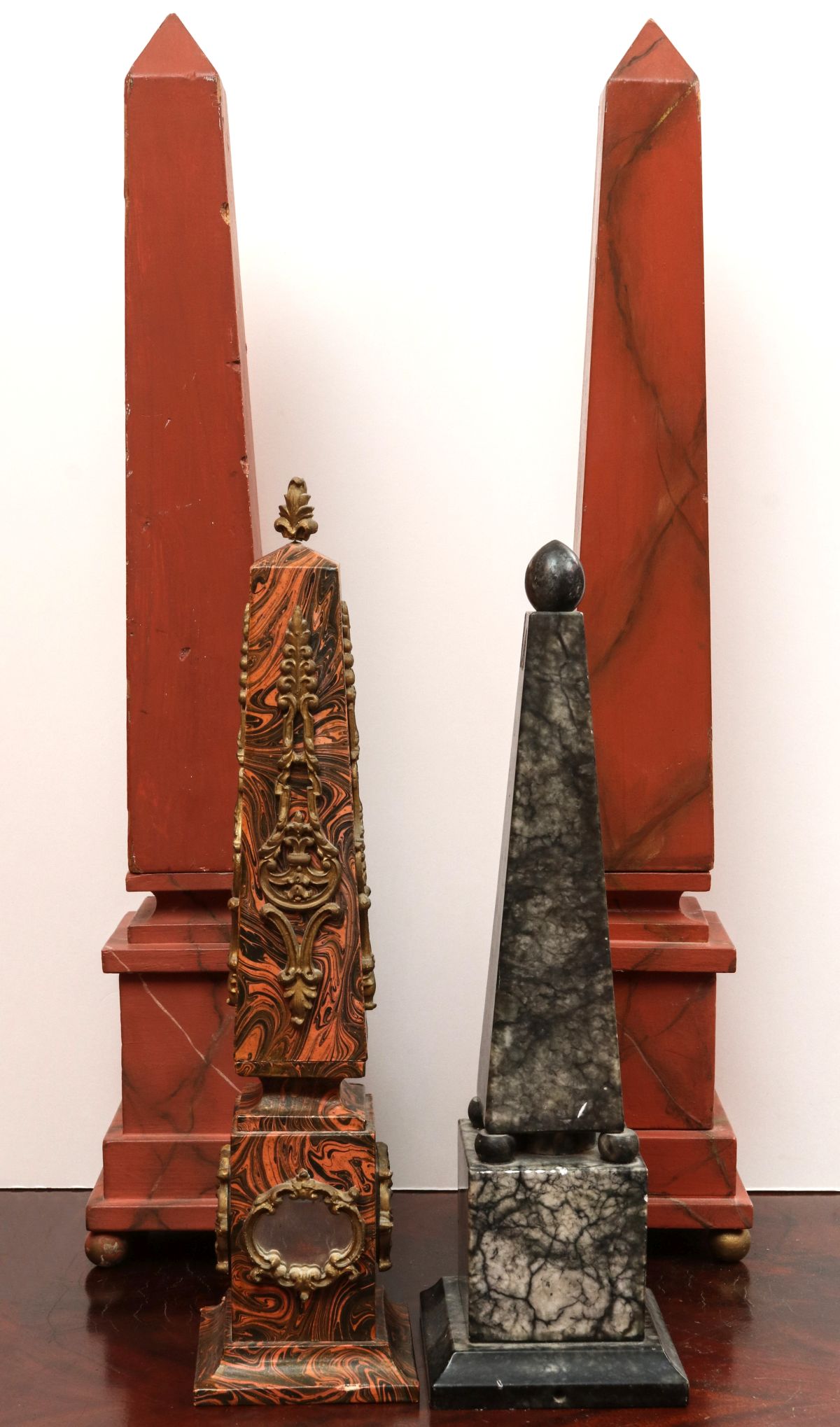 FOUR DECORATIVE OBELISKS