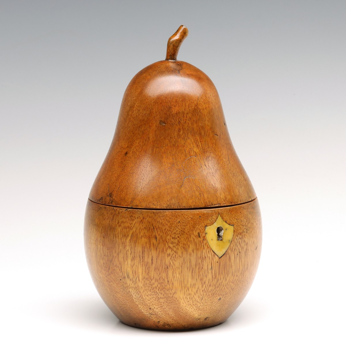 A 19TH CENTURY PEAR FORM FRUITWOOD TEA CADDY