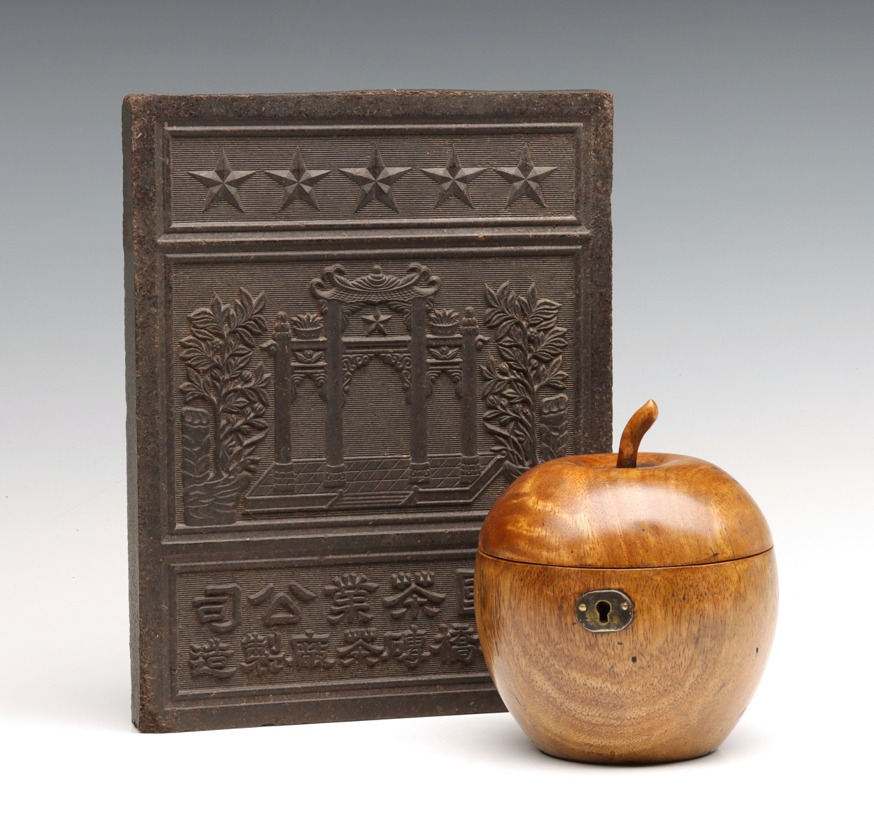 A 19TH C. APPLE FORM TEA CADDY AND TEA BRICK