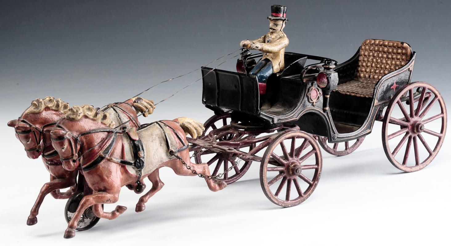 A SCARCE PRATT LETCHWORTH BAROUCHE IRON TOY CARRIAGE