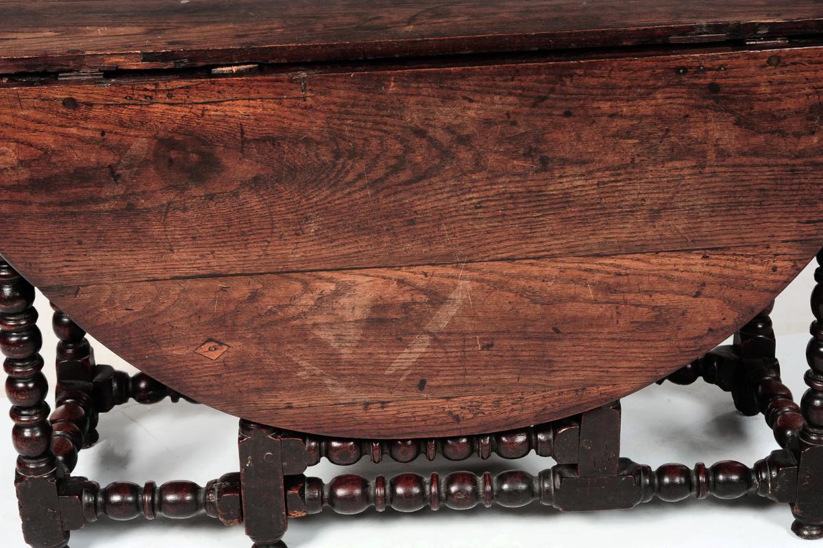 A 17TH C. OAK BOBBIN TURNED GATE LEG TABLE 