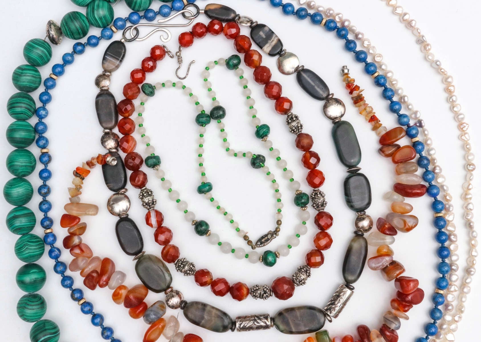 A COLLECTION OF SEMI-PRECIOUS STONE BEAD NECKLACES