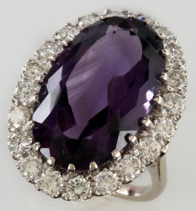 A 14K DIAMOND AND AMETHYST FASHION RING