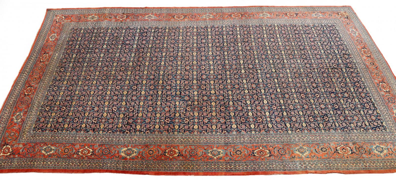 AN ANTIQUE PALACE SIZE TABRIZ CARPET