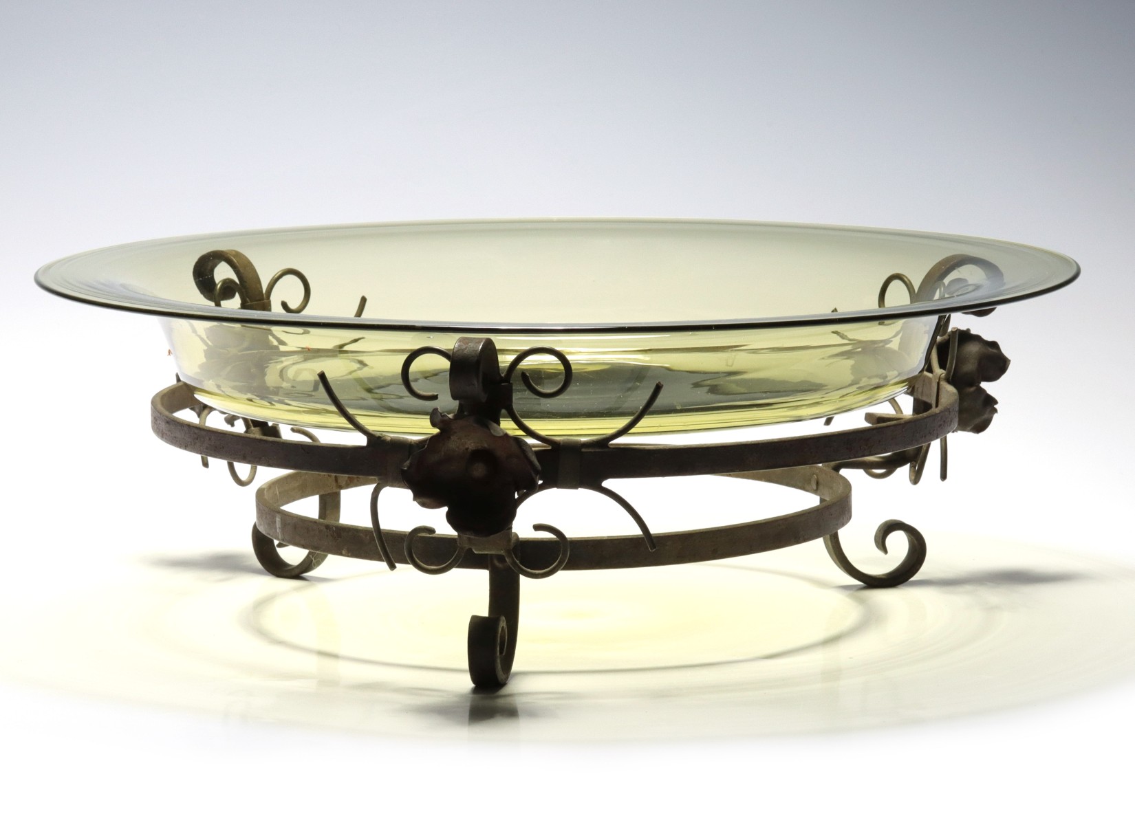 AN ART GLASS AND IRON CENTERPIECE ATTRIBUTED STEUBEN