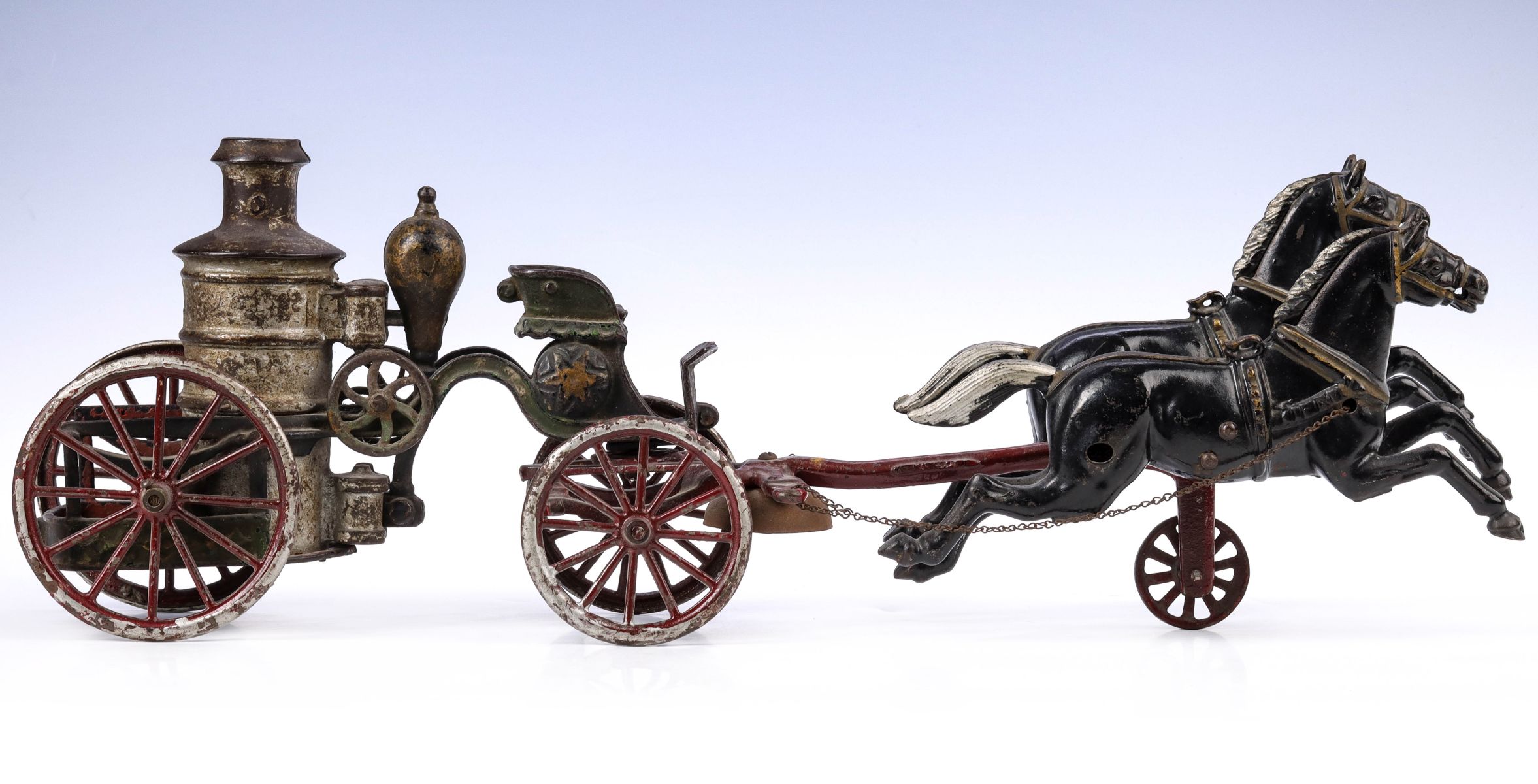 A 19TH C AMERICAN TOY CAST IRON HORSE DRAWN FIRE PUMPER