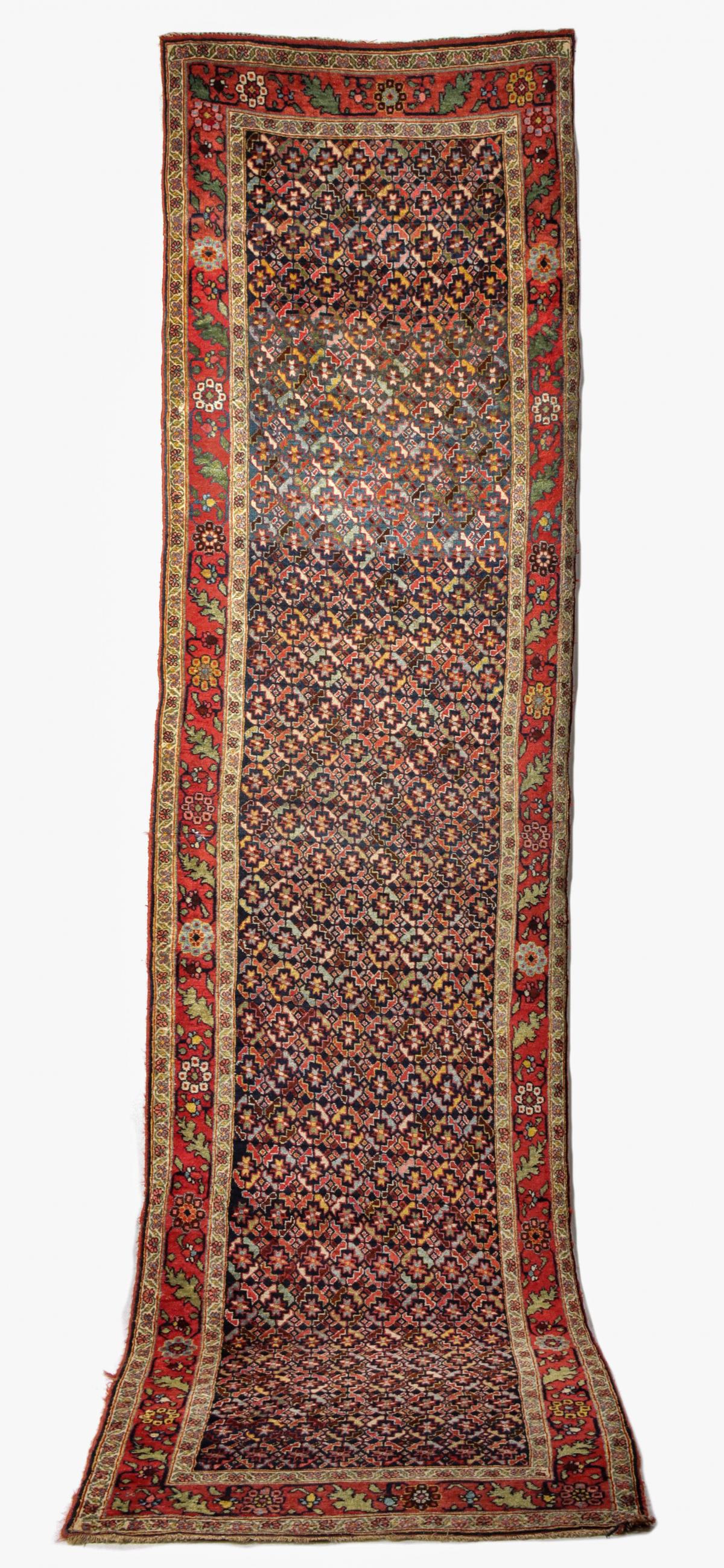 A GOOD ANTIQUE BIDJAR RUNNER. ONE OF A PAIR.