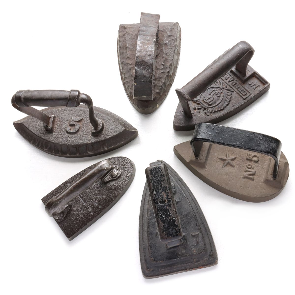 SIX UNUSUAL ANTIQUE SAD IRONS