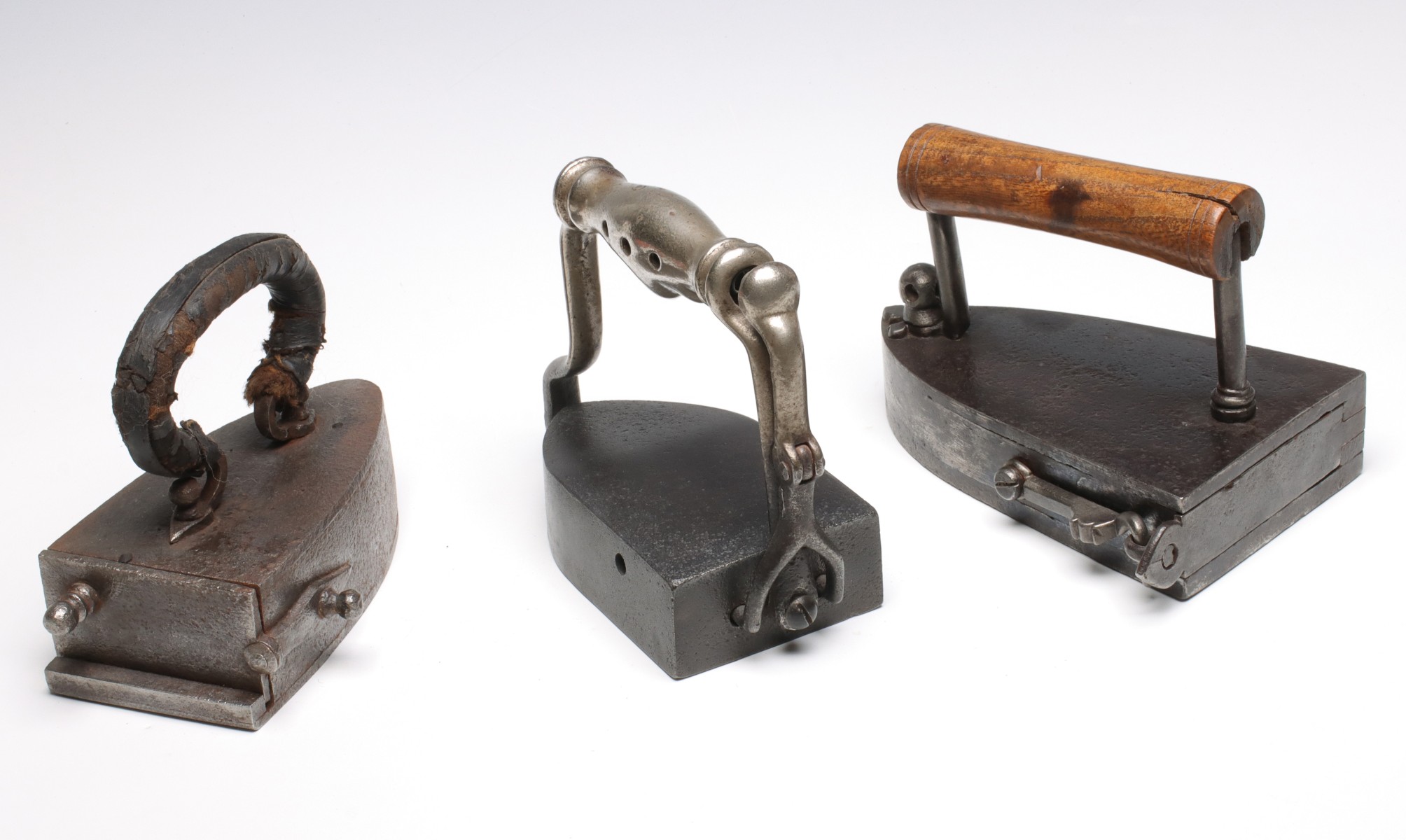 ANTIQUE BOX IRONS AND SAD IRON WITH REVOLVING PLATE