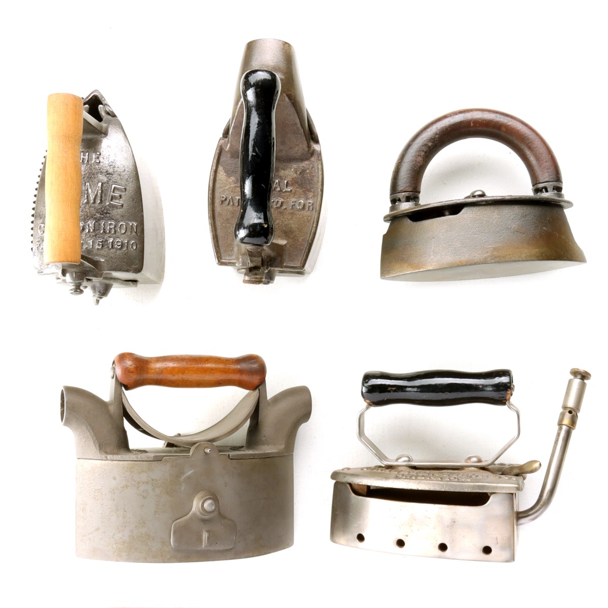 FIVE ANTIQUE GAS AND CHARCOAL IRONS