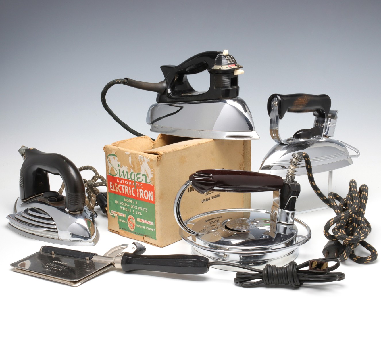 FIVE VINTAGE ELECTRIC IRONS, CIRCA MID-20TH C.