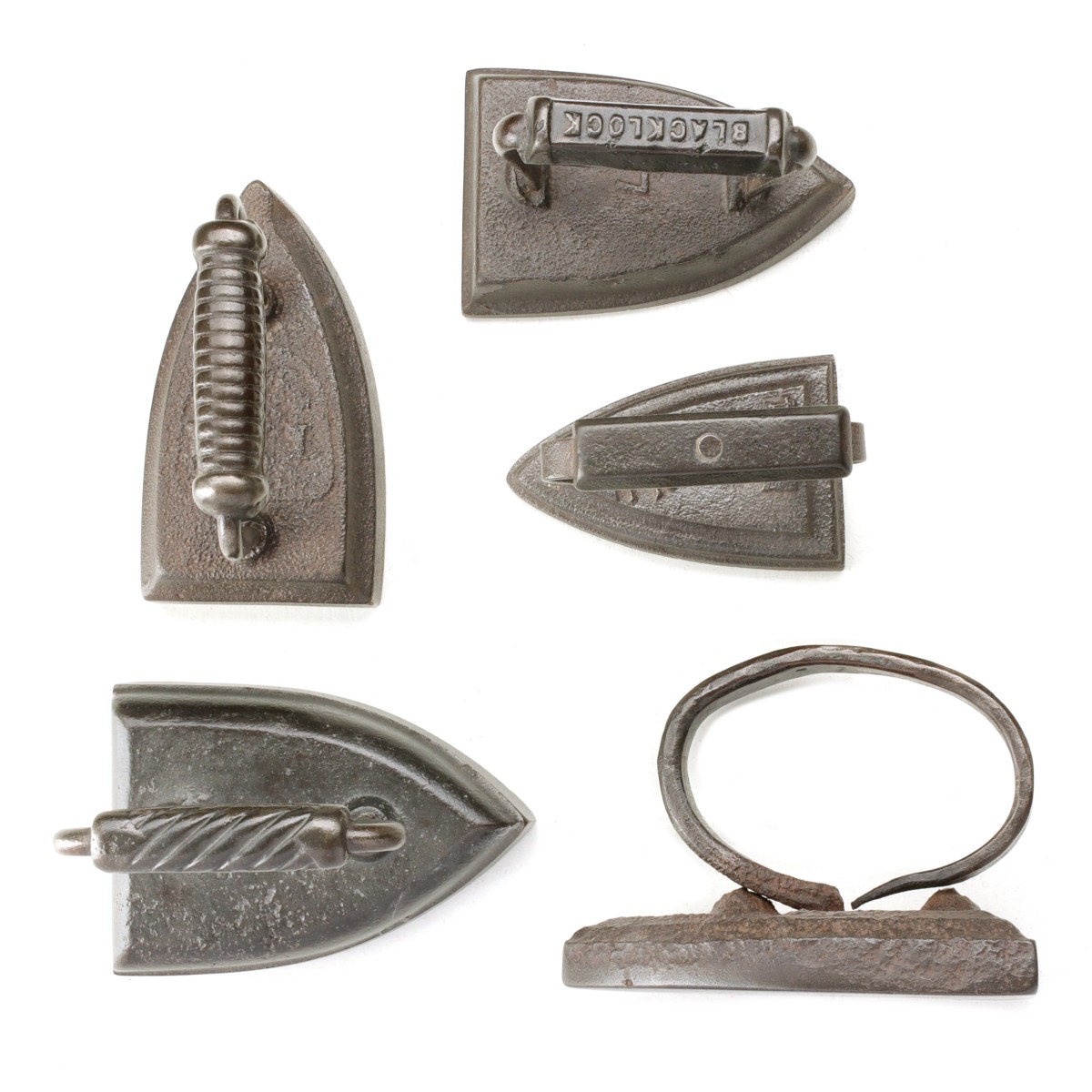 FIVE ANTIQUE SAD IRONS