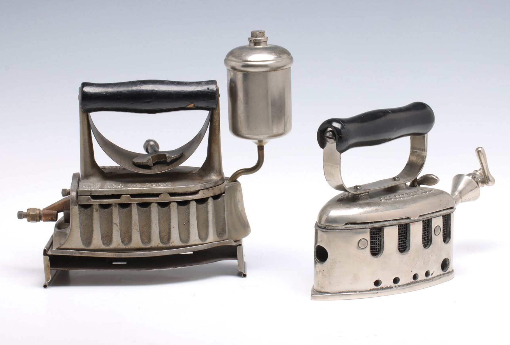TWO ANTIQUE GAS IRONS