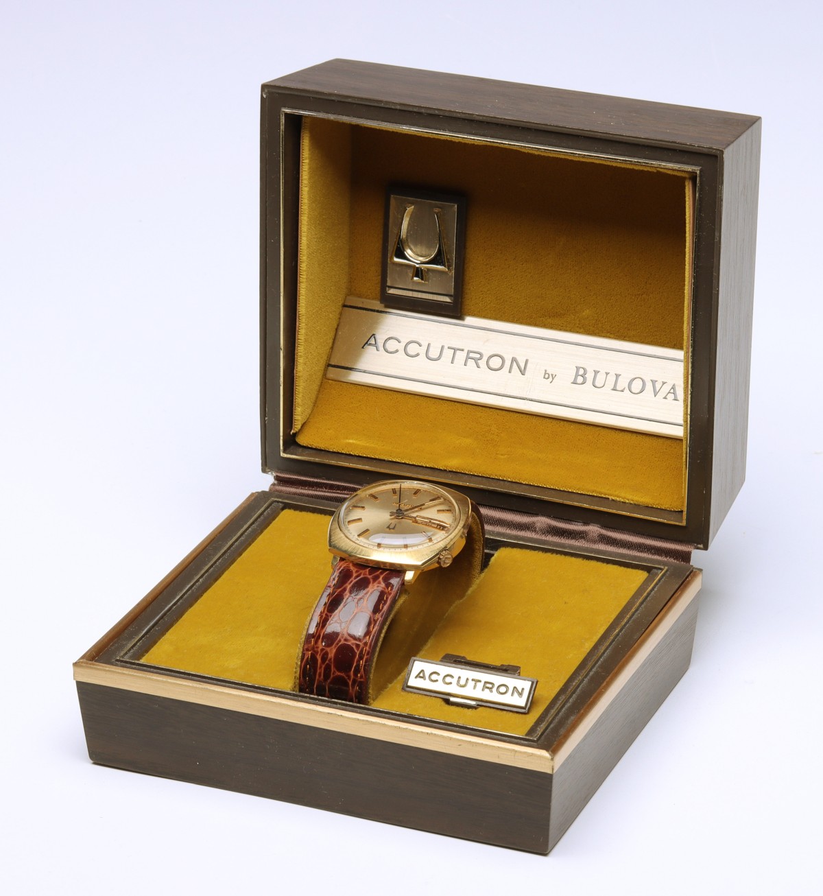 A 14K GOLD BULOVA ACCUTRON IN ORIGINAL BOX