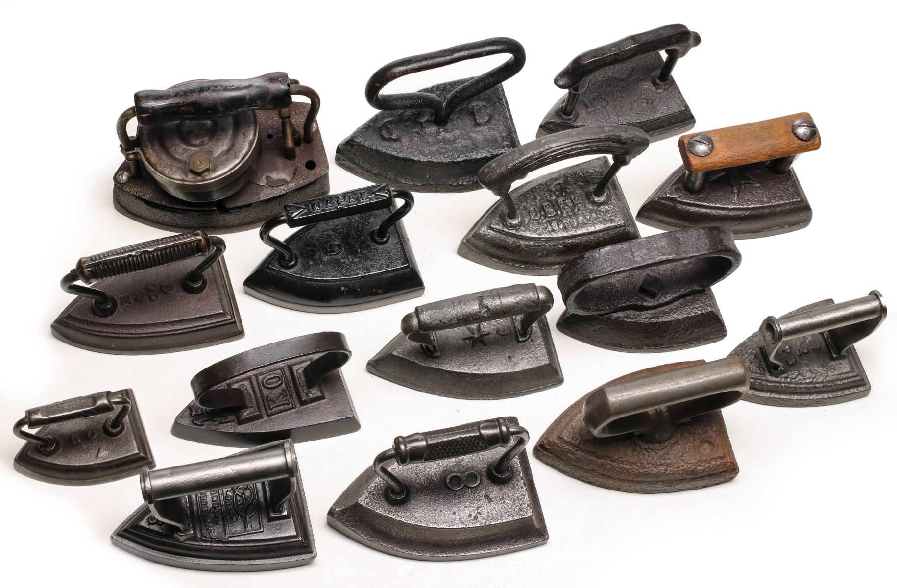 A COLLECTION OF ANTIQUE SAD IRONS