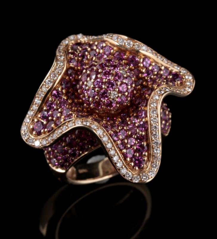 AN AMETHYST AND DIAMOND FLOWER-FORM FASHION RING