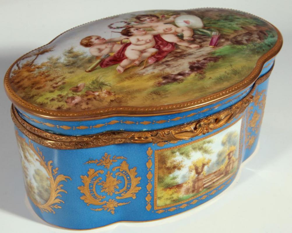 A FINE BLEU CELESTE GROUND SEVRES TYPE BOX WITH CHERUBS