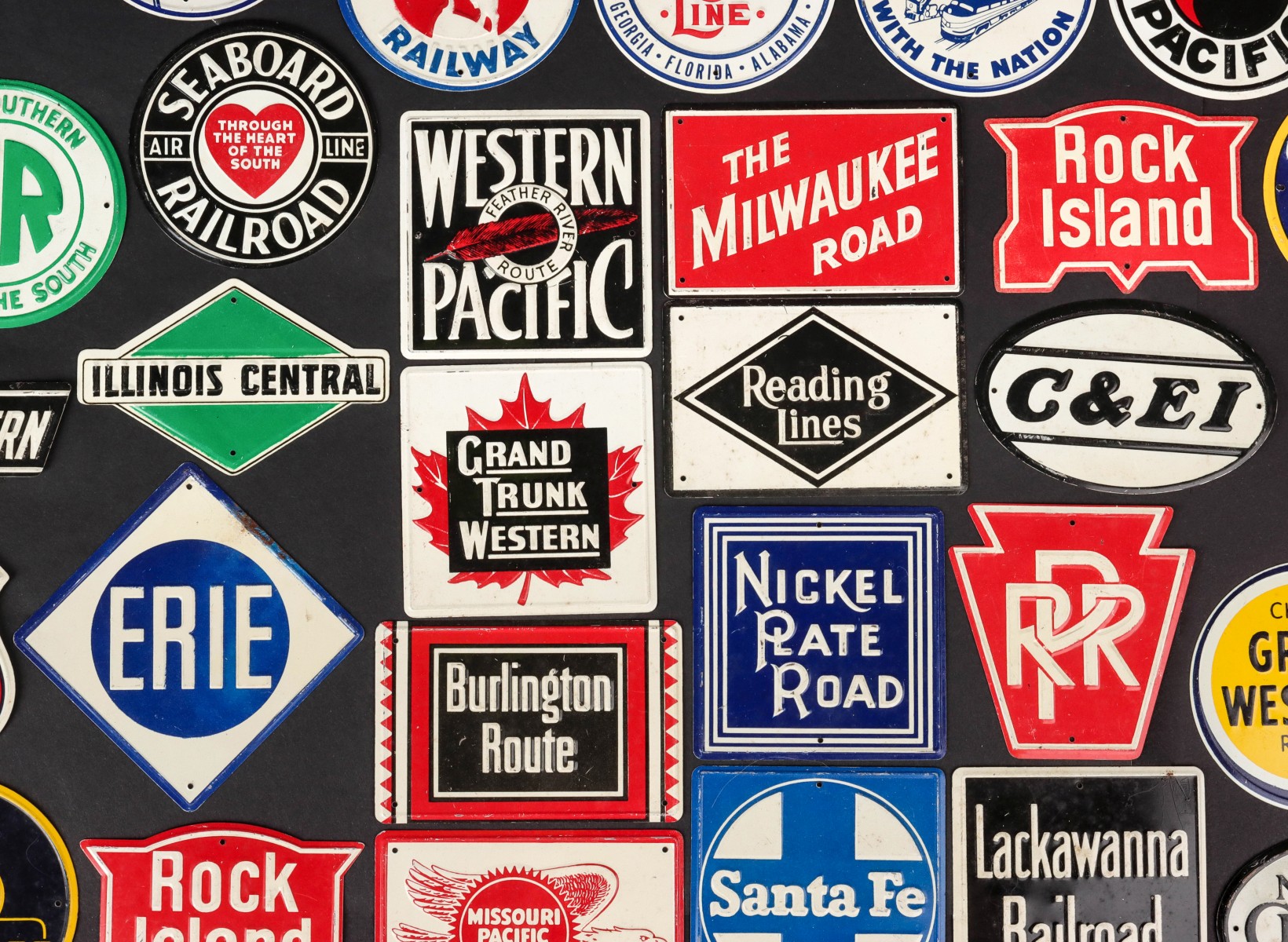 TWENTY-NINE TIN CEREAL BOX RAILROAD LOGOS C. 1960