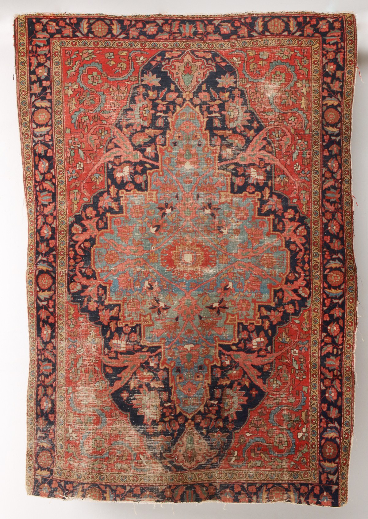 AN ANTIQUE PERSIAN MEDALLION AREA RUG