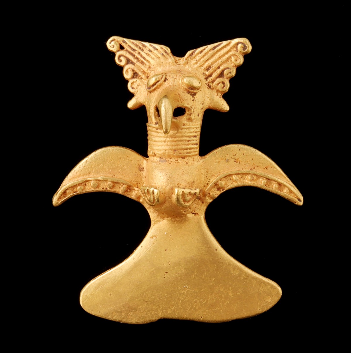 A PRE-COLUMBIAN STYLE 14K GOLD HARPY EAGLE PENDANT