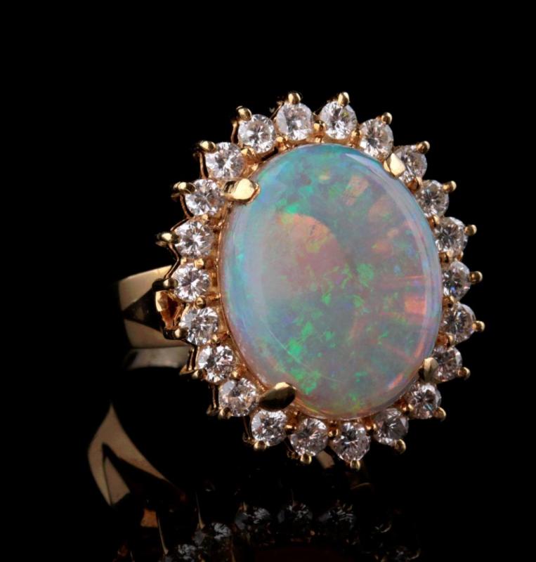 AN 18K AUSTRALIAN OPAL AND DIAMOND RING