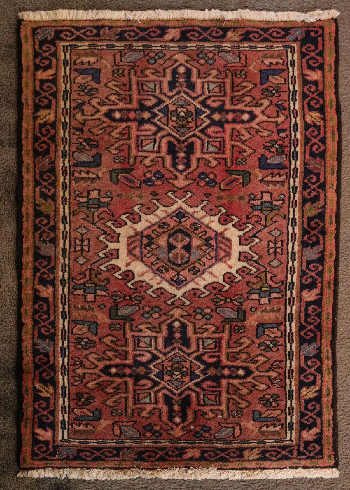 A PERSIAN KARAJA HAND MADE WOOL ON COTTON RUG