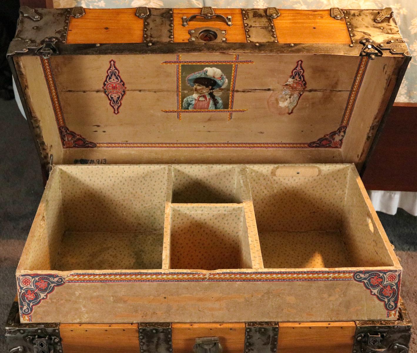 AN IRON MOUNTED WOOD SLAT TRAVEL TRUNK CIRCA 1880